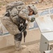 Army Sergeant Inspects Debris During Route Clearance Operation in Baghdad