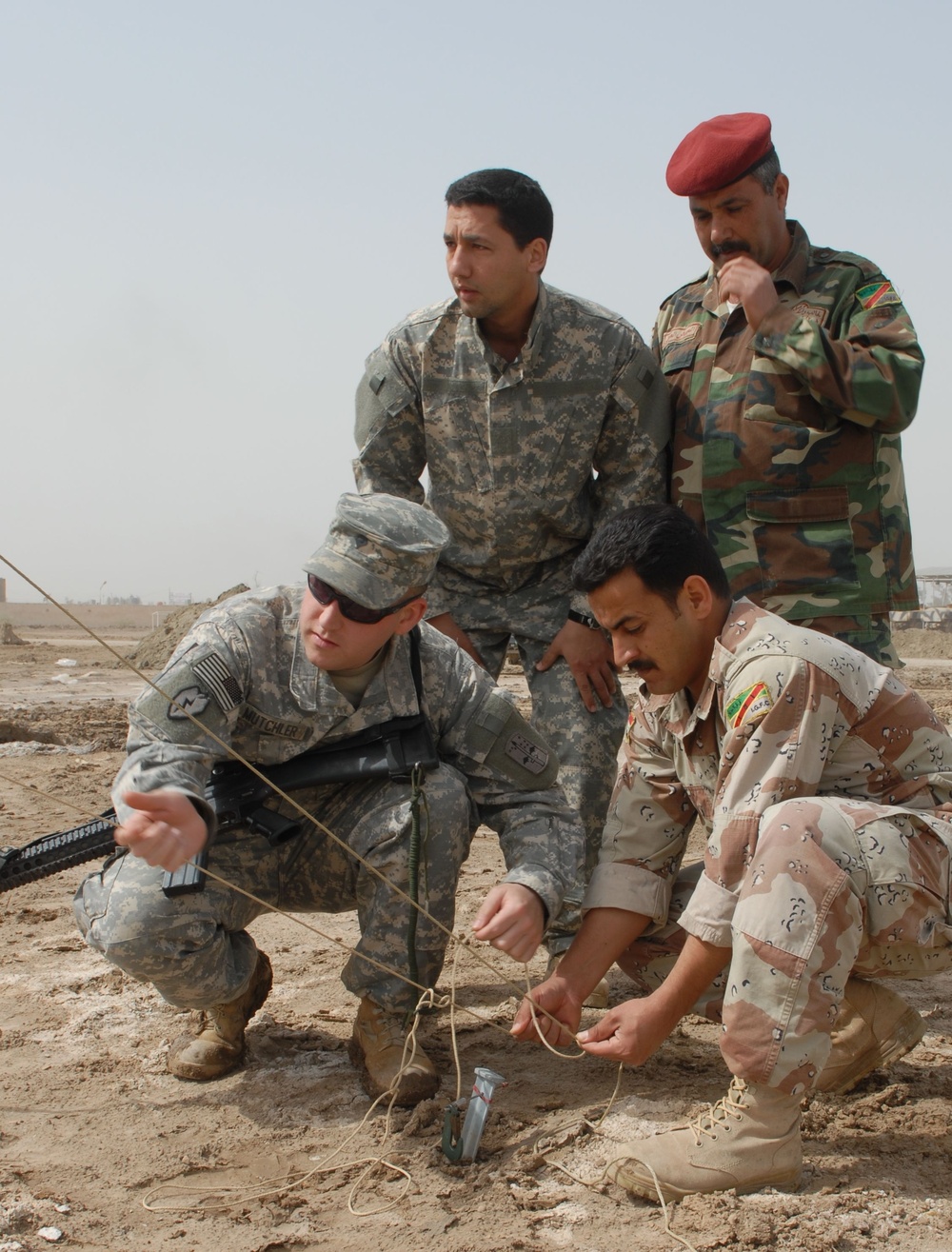 U.S. Soldier Trains Iraqi Counterparts on Antenna Setup