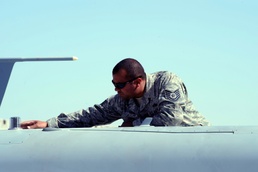 Air Force Tech. Sgt. Inspects MQ-9 Reaper Drone for Damage in Afghanistan