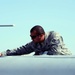 Air Force Tech. Sgt. Inspects MQ-9 Reaper Drone for Damage in Afghanistan