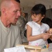 Young Iraqi Girl Finds Comfort in U.S. Soldier at Camp Victory