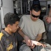 Air Force Medic Teaches Iraqi Youth First Aid at Camp Victory