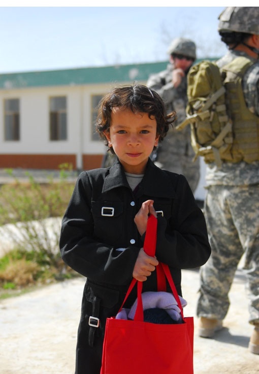 Afghan Girl Receives School Supplies from U.S. Troops