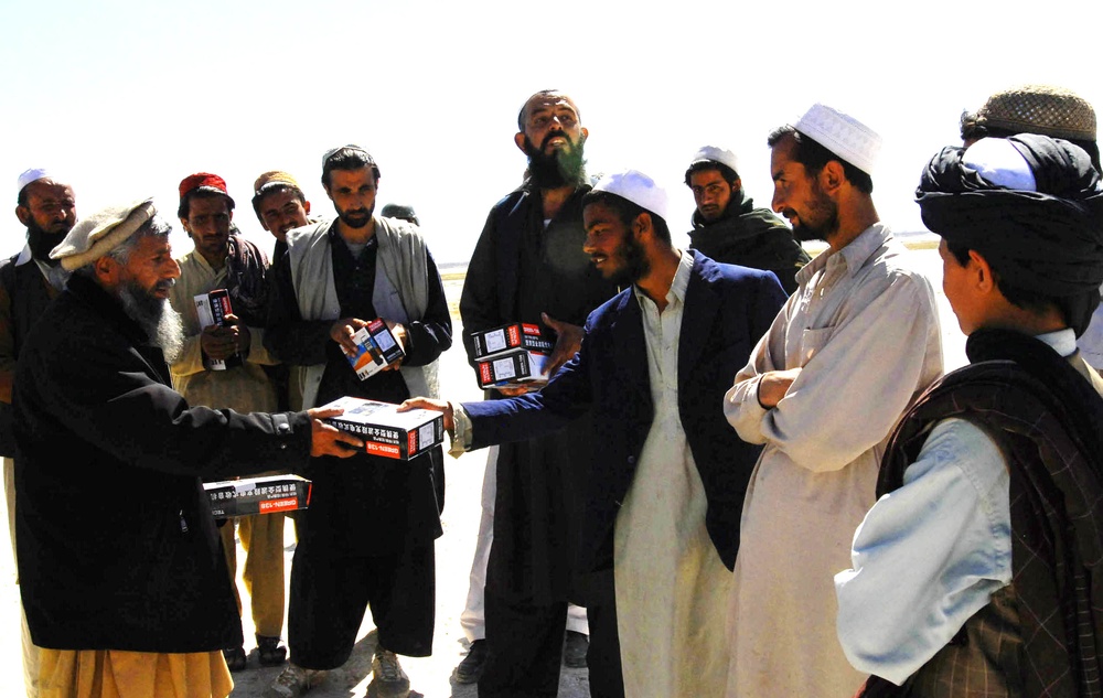 Afghan Leader Distributes Radios to Tribal Elders During Joint Operation