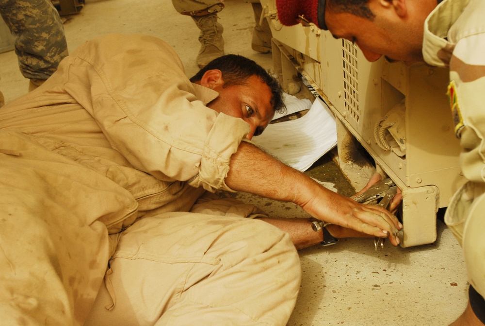 Iraqi Army Mechanics Learn Generator Maintenance at Forward Operating Base