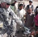 U.S. Soldier Distributes Shoes to Afghan Children