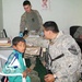 U.S. Soldiers Provide Medical Aid to Iraqi Boy During Humanitarian Mission