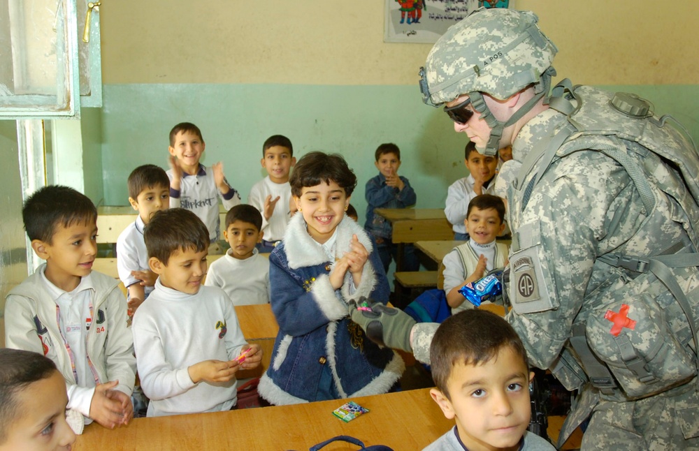 U.S. Soldier Spreads Goodwill with Candy Handout at Iraqi School