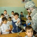 U.S. Soldier Spreads Goodwill with Candy Handout at Iraqi School