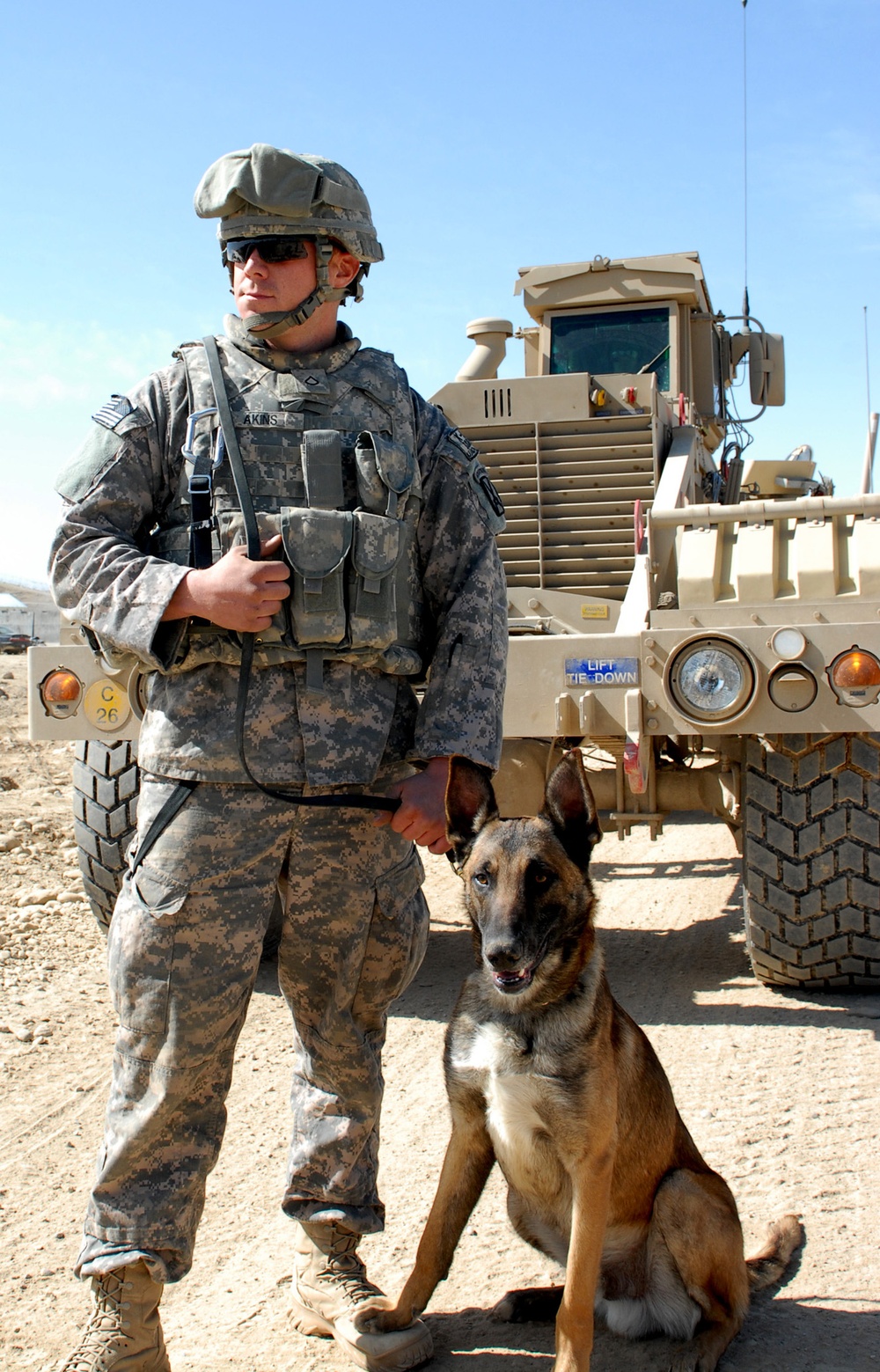 Soldier and Canine Partner Search for IEDs in Afghanistan