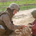 Marine Officer Shares Cookies and Smiles with Afghan Child