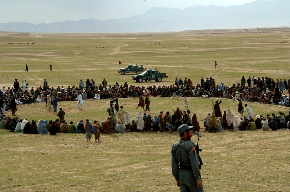 Afghan Police Officer Provides Security During Traditional Game Tournament