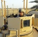 Soldier Prepares M-240B Machine Gun for Combat Patrol