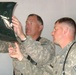Air Force Medic and Army Civil Affairs Officer Examine X-Ray at Afghan Clinic