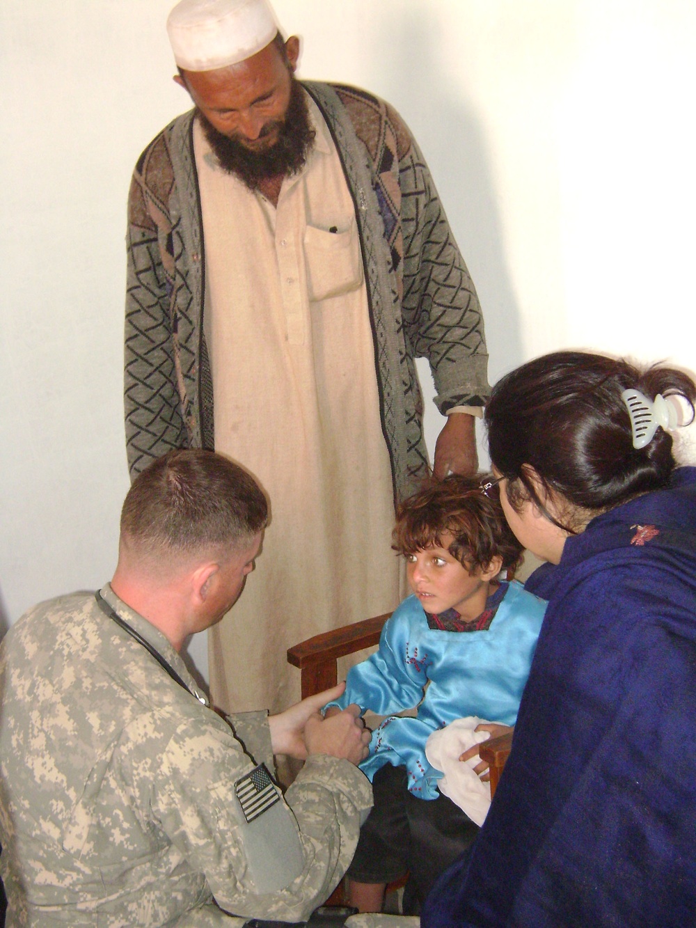Air Force Medic Provides Care to Injured Afghan Girl
