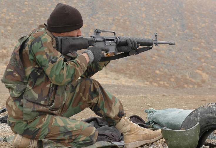 Afghan Soldier Trains with M-16 Rifle at Forward Operating Base