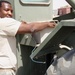 Army Spc. Repairs Forklift Battery in Iraq