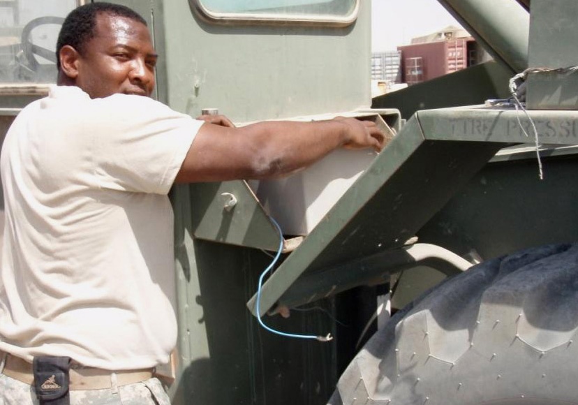 Army Spc. Repairs Forklift Battery in Iraq