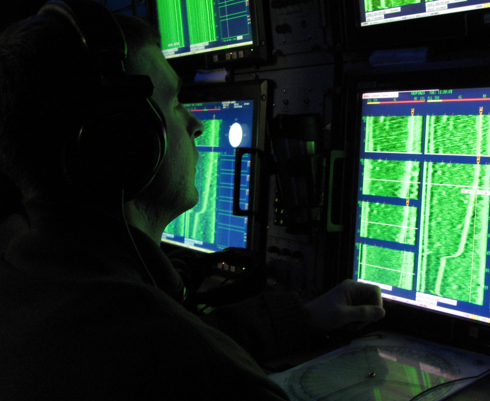Submarine Sonar Operator Monitors Systems During Drill