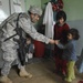 Soldier Shares Supplies with Afghan Girl at Provincial Hospital