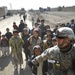 U.S. Soldier Holds Back Afghan Children Seeking Handouts