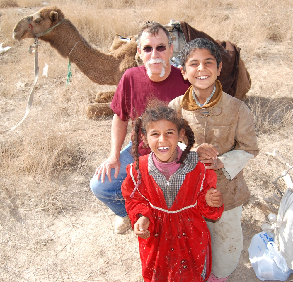 Army Corps of Engineers Employee Bonds with Iraqi Children on Deployment