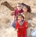 Army Corps of Engineers Employee Bonds with Iraqi Children on Deployment