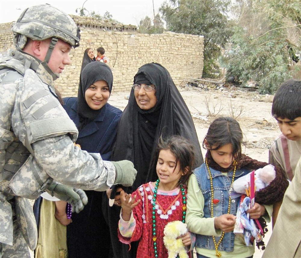 Louisiana Guardsman Shares Mardi Gras Spirit with Iraqi Children