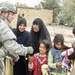 Louisiana Guardsman Shares Mardi Gras Spirit with Iraqi Children