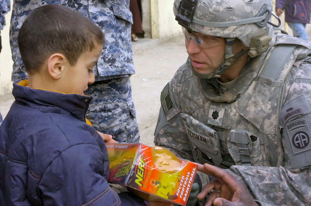 U.S. Army Officer Distributes School Supplies to Iraqi Children