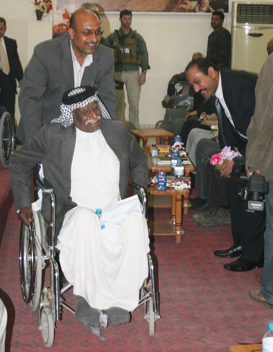 Iraqi Man Tests New Wheelchair at Rehabilitation Center