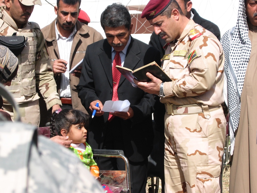 Iraqi Army, Clinic Manager Donate Wheelchair to Girl with Nerve Condition