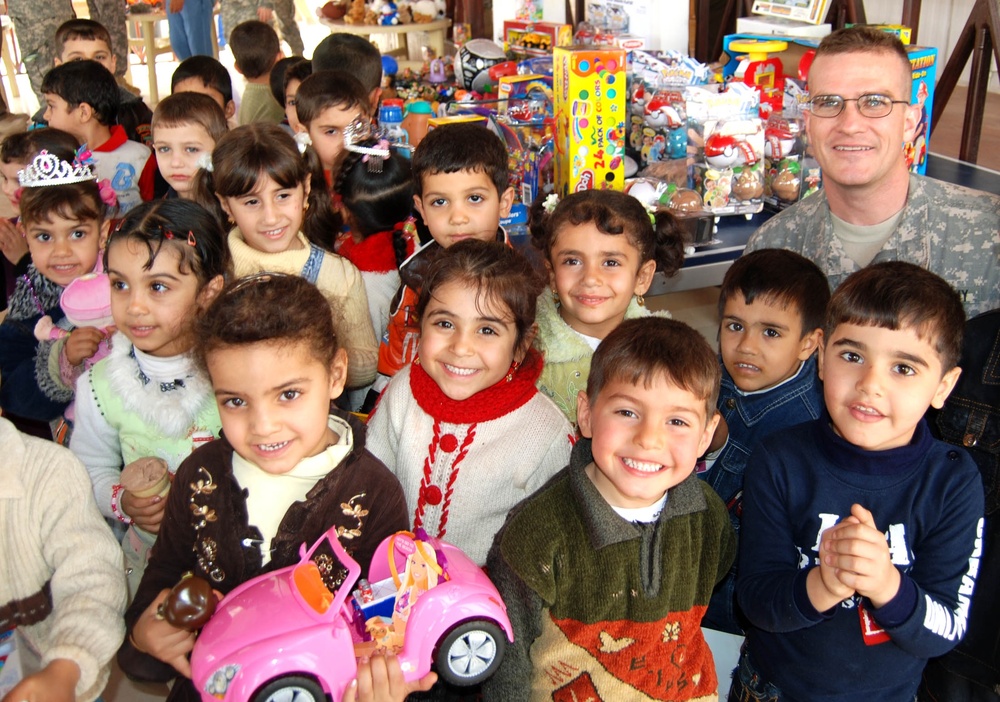 Iraqi Students Delight in New Toys Donated by U.S. Army Reservist's Co-Workers
