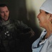 Female Afghan Doctor Discusses Medical Needs with U.S. Military Physician's Assistant
