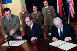 Gates Signs Defense Agreement with Poland in Krakow
