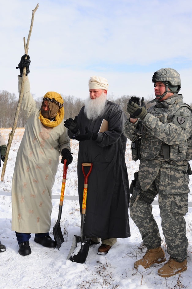 Army Col. Copes Leads Mock Groundbreaking Ceremony with Afghan Role Player