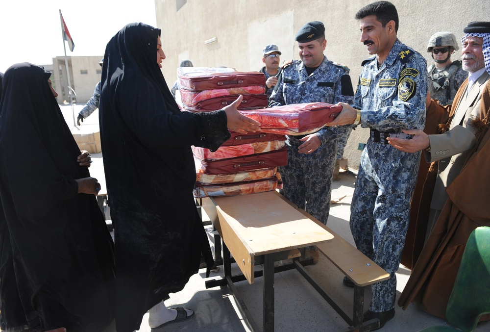 Iraqi General Distributes Blankets to Residents in Baghdad