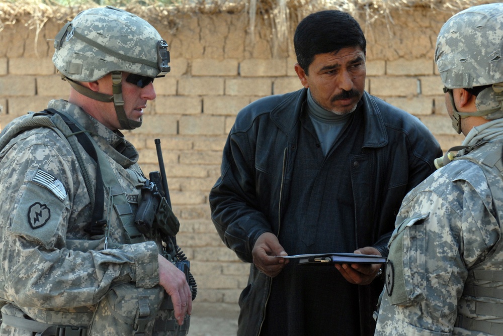 Army Officer Discusses School Renovation Plans with Headmaster