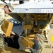 Soldiers Unload Supplies from C-23 Sherpa for Distribution
