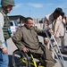 Iraqi Boy Tries Out New Wheelchair at Sadr City Compound