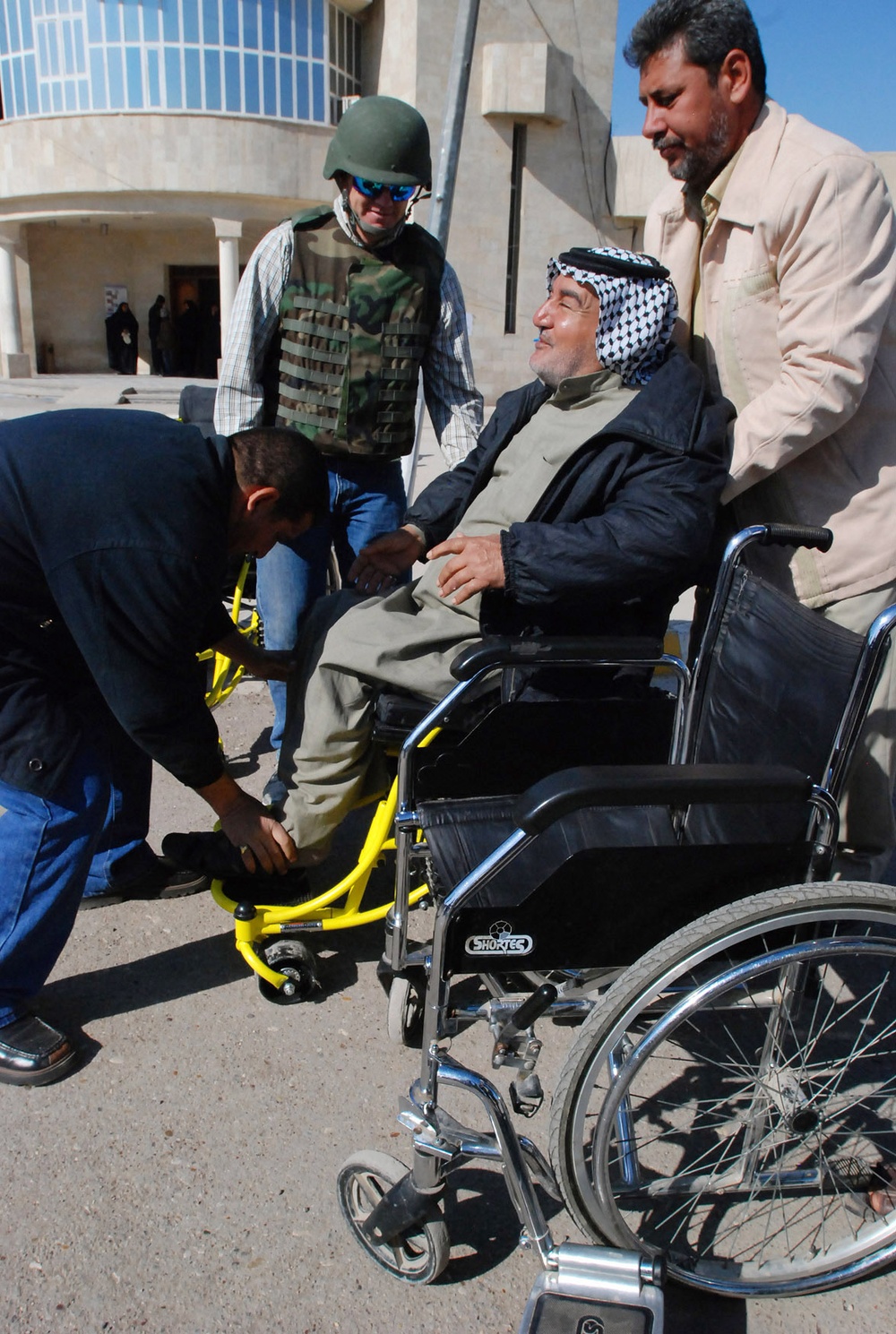 Disabled Iraqi Man Receives Wheelchair Donation in Sadr City