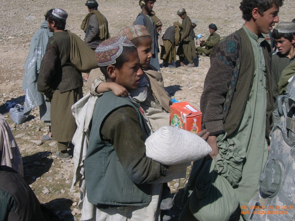 Afghan Children Receive Aid from Coalition Forces in Oruzgan Province