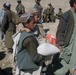 Afghan Children Receive Aid from Coalition Forces in Oruzgan Province
