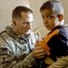 Army Medic Provides Care to Iraqi Boy During Medical Engagement