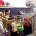 U.S. Soldier Greets Iraqi Children During Medical Engagement
