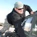 Kentucky National Guard Soldier Checks Humvee at Camp Atterbury