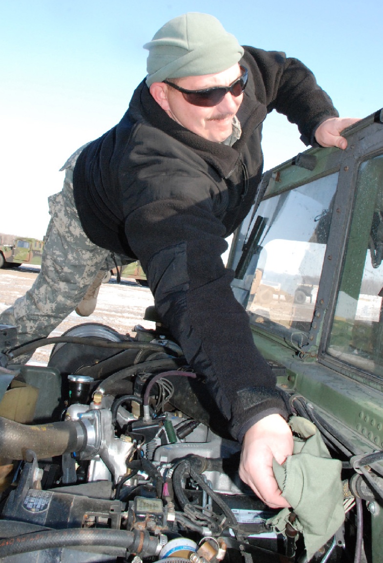 Kentucky National Guard Soldier Checks Humvee at Camp Atterbury
