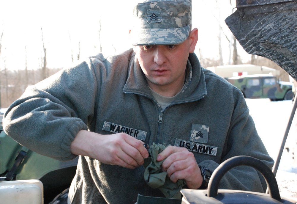 Kentucky National Guard Soldier Maintains Humvee at Camp Atterbury