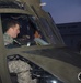 Army, Canadian Air Force Pilots Prepare for Night Flight in Chinook Helicopter