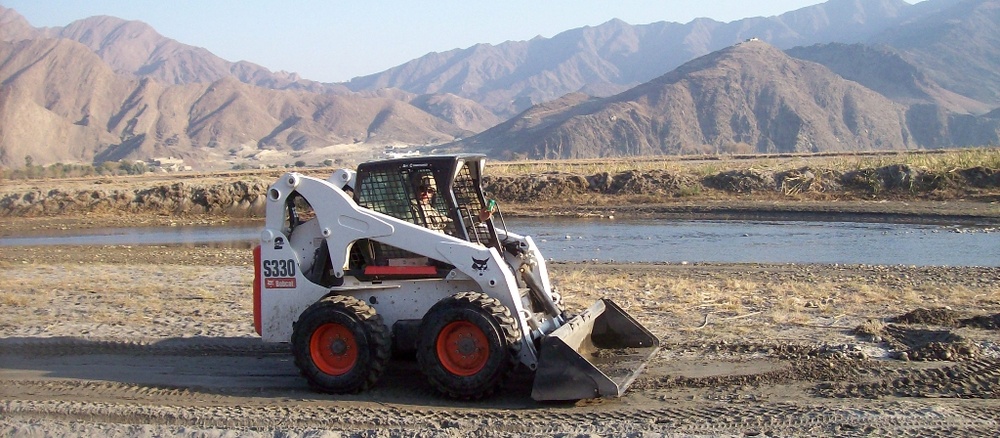 Army Sergeant Operates Bobcat to Improve Afghan Roads